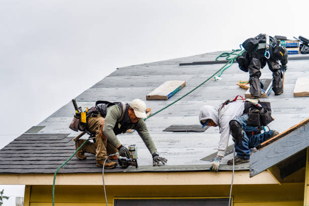 Professional Roofing technician working in Riverside, OR